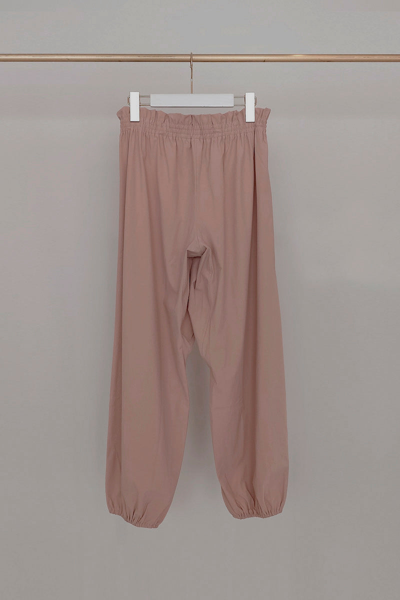 Retune. warm up pants / pink