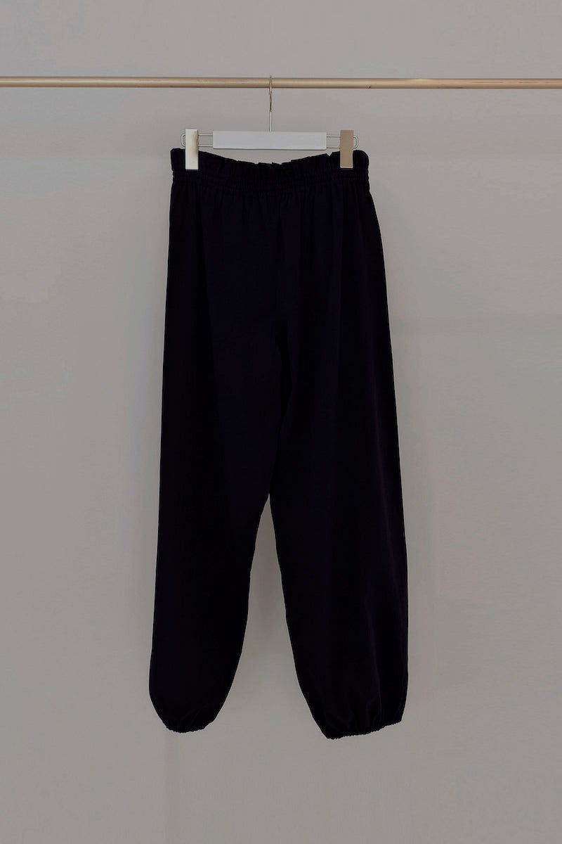 Retune. warm up pants / black