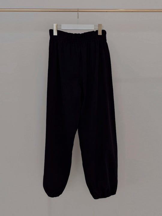 Retune. warm up pants / black