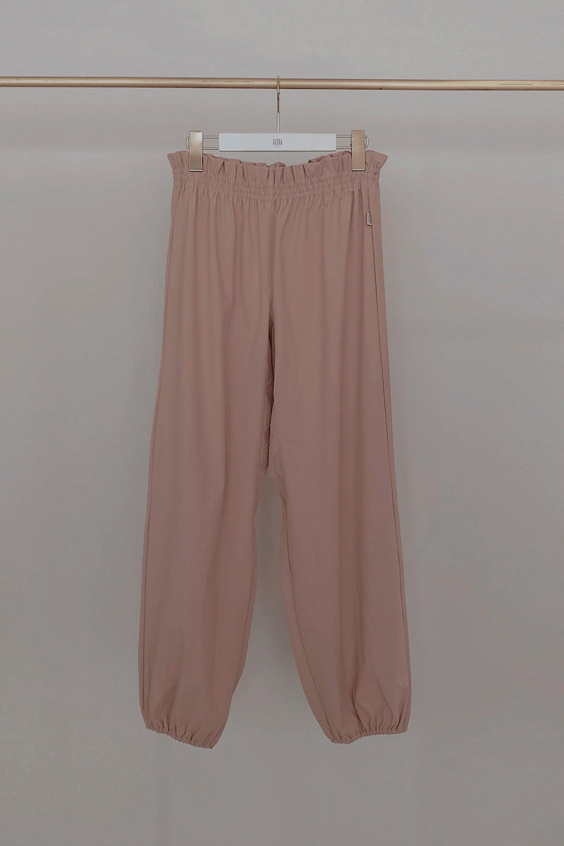 Retune. warm up pants / pink