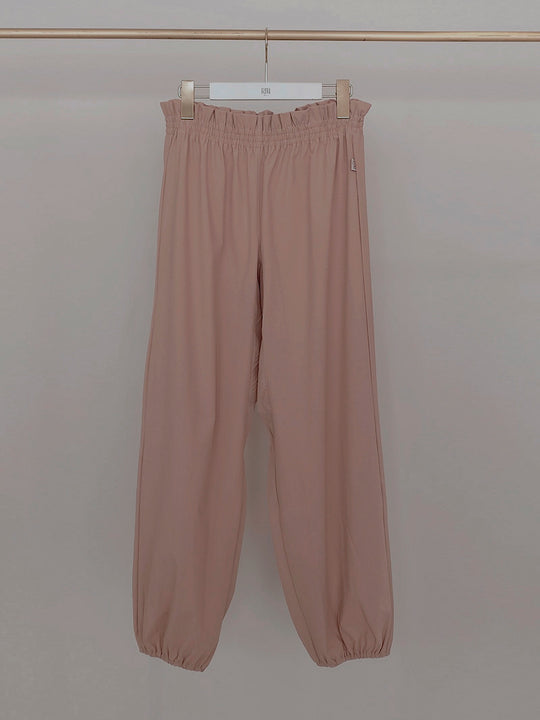 Retune. warm up pants / pink