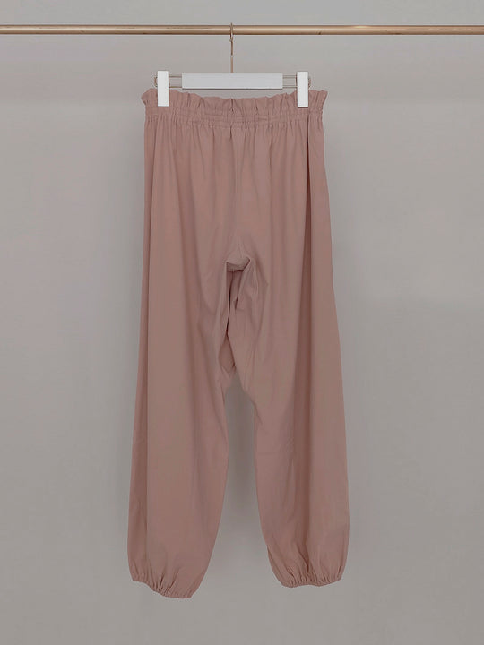 Retune. warm up pants / pink