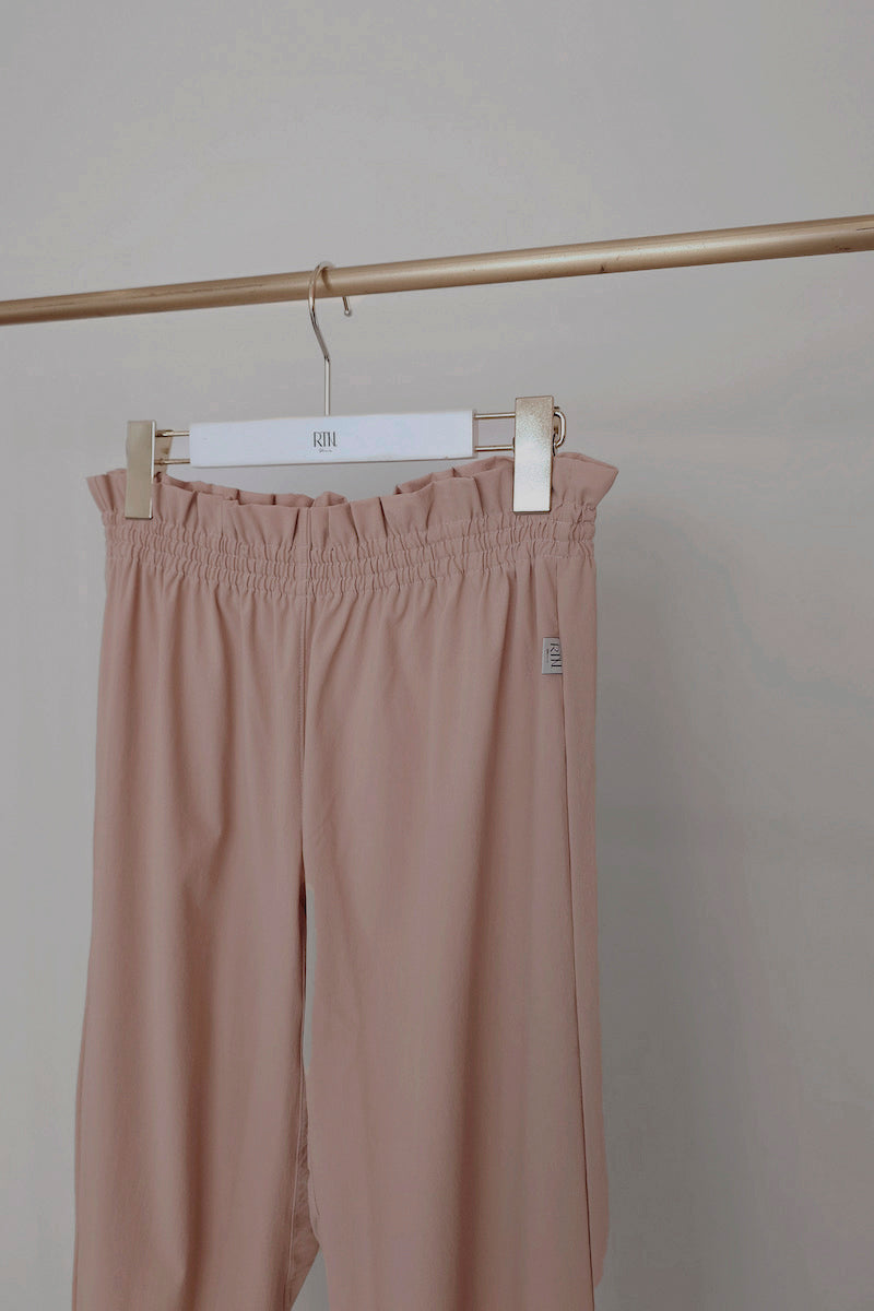 Retune. warm up pants / pink