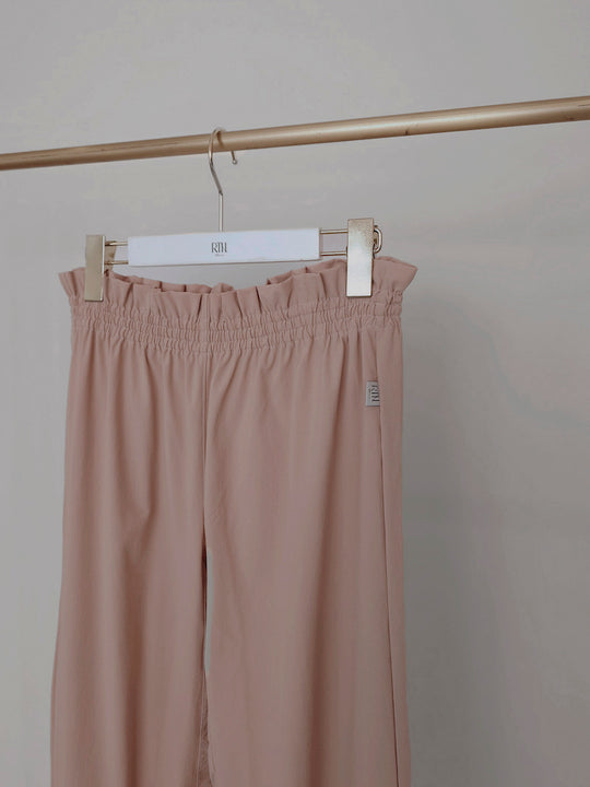 Retune. warm up pants / pink