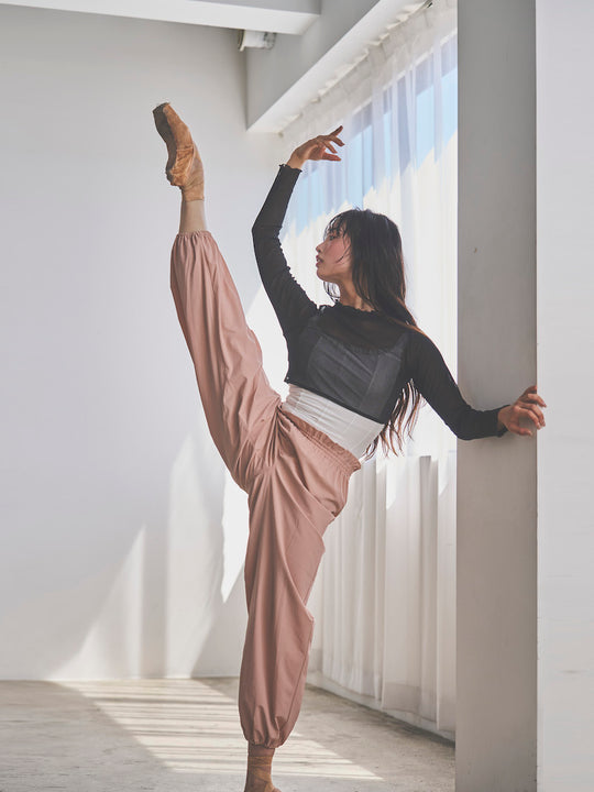 Retune. warm up pants / pink
