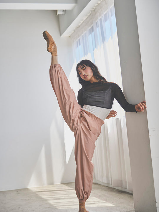 Retune. warm up pants / pink