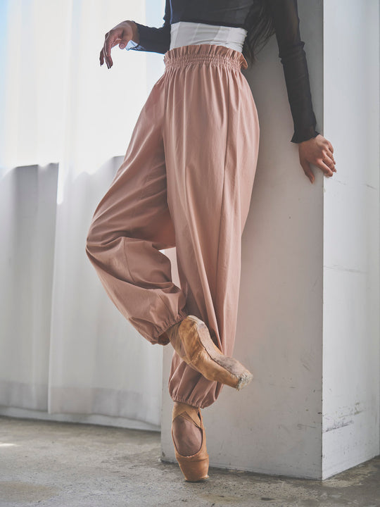 Retune. warm up pants / pink