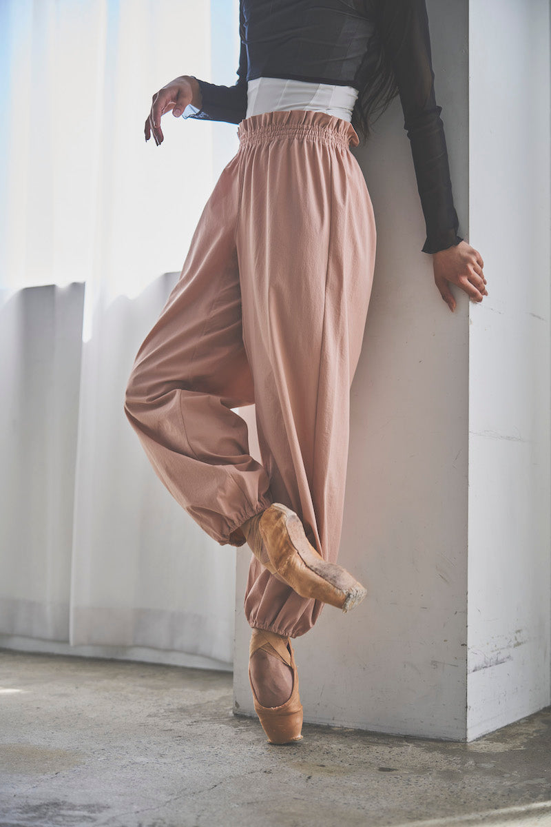 Retune. warm up pants / pink