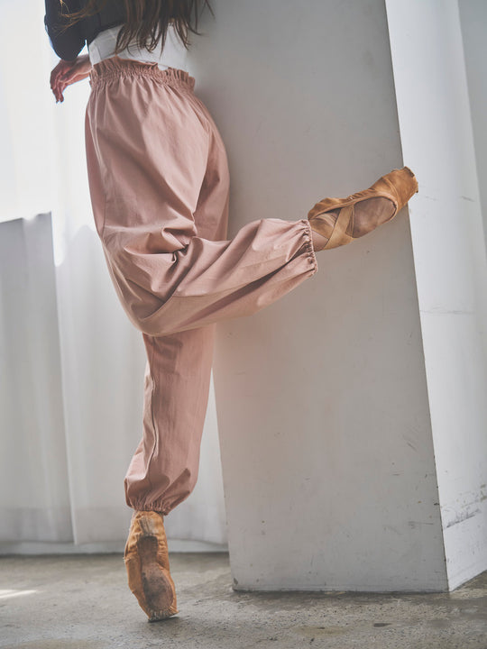 Retune. warm up pants / pink
