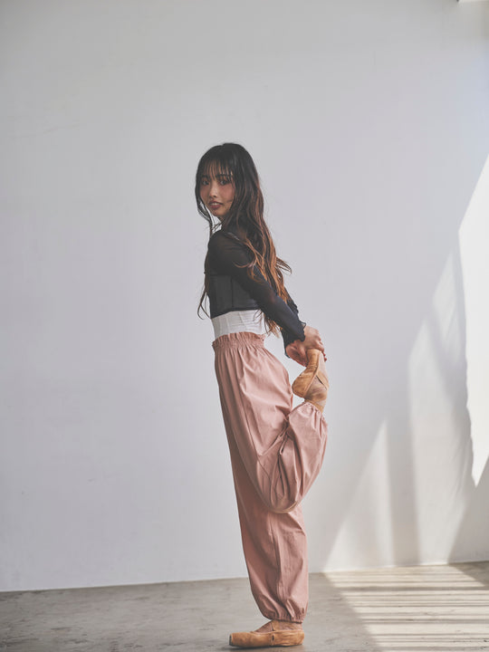 Retune. warm up pants / pink
